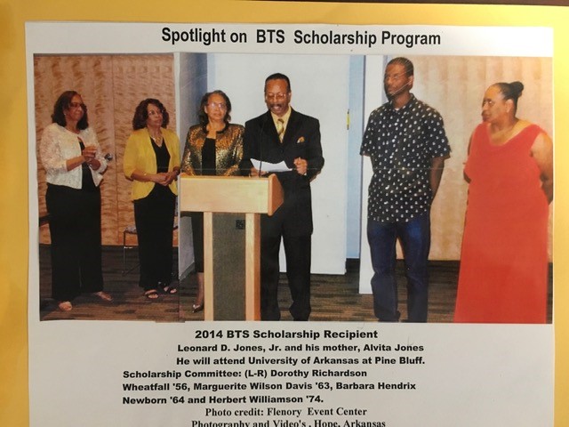 Printed page headed “Spotlight on BTS Scholarship Program,” with a photograph of six people standing at and beside a podium at the 2014 BTS Scholarship presentation, and a printed caption below.