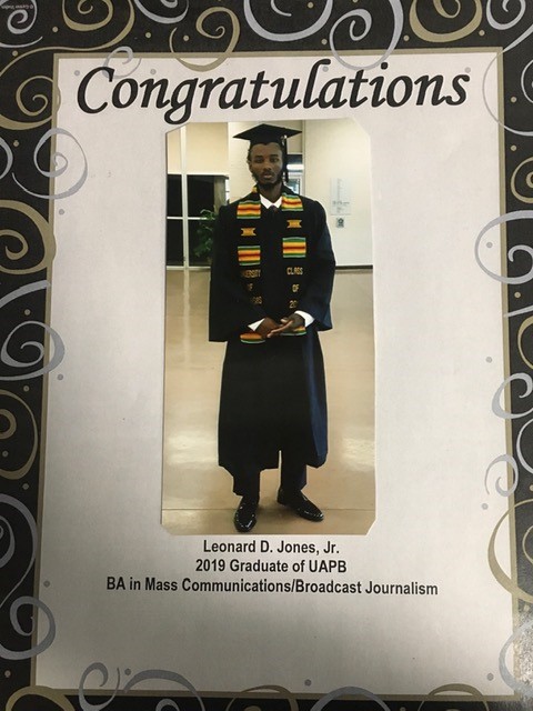 Congratulations card with a photograph of Leonard D. Jones, Jr. in cap, gown and kente stole, captioned “Leonard D. Jones, Jr., 2019 Graduate of UAPB, BA in Mass Communications/Broadcast Journalism.”